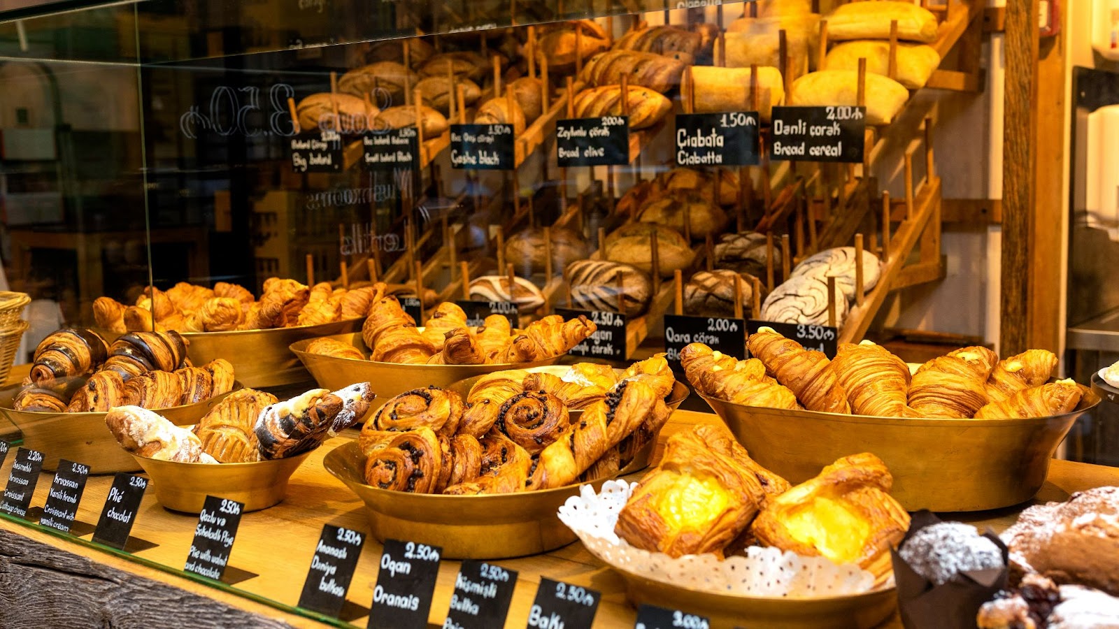 Display of mixed pastries and breads in a bakery
