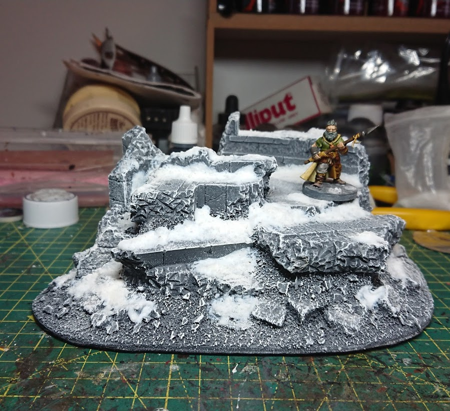 A Frostgrave barbarian on a finished piece of ruined terrain.
