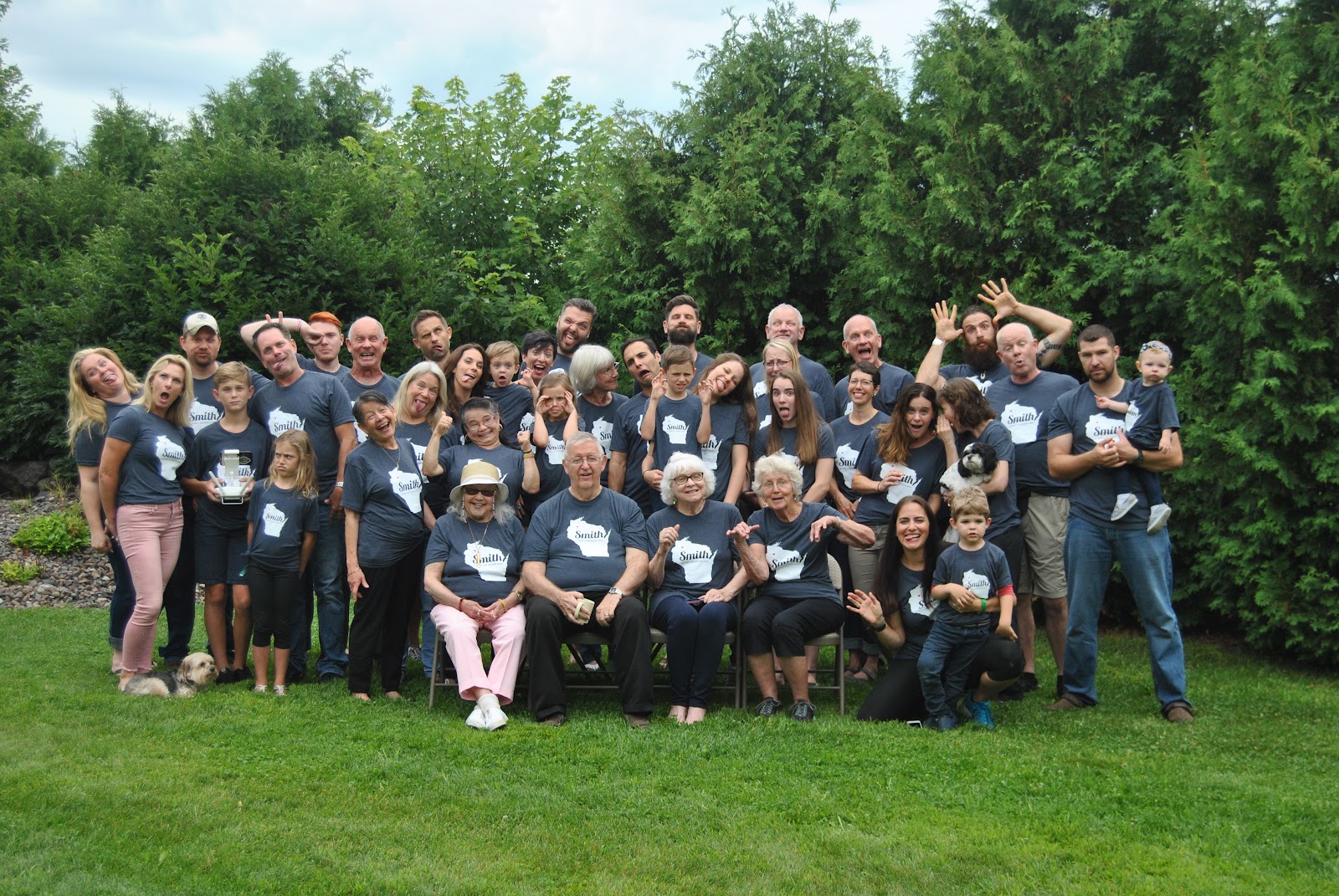 large family lined up for "crazy photo" at family reunion.