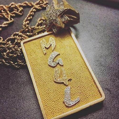 A picture containing locket, key, accessory, picture frame
Description automatically generated
