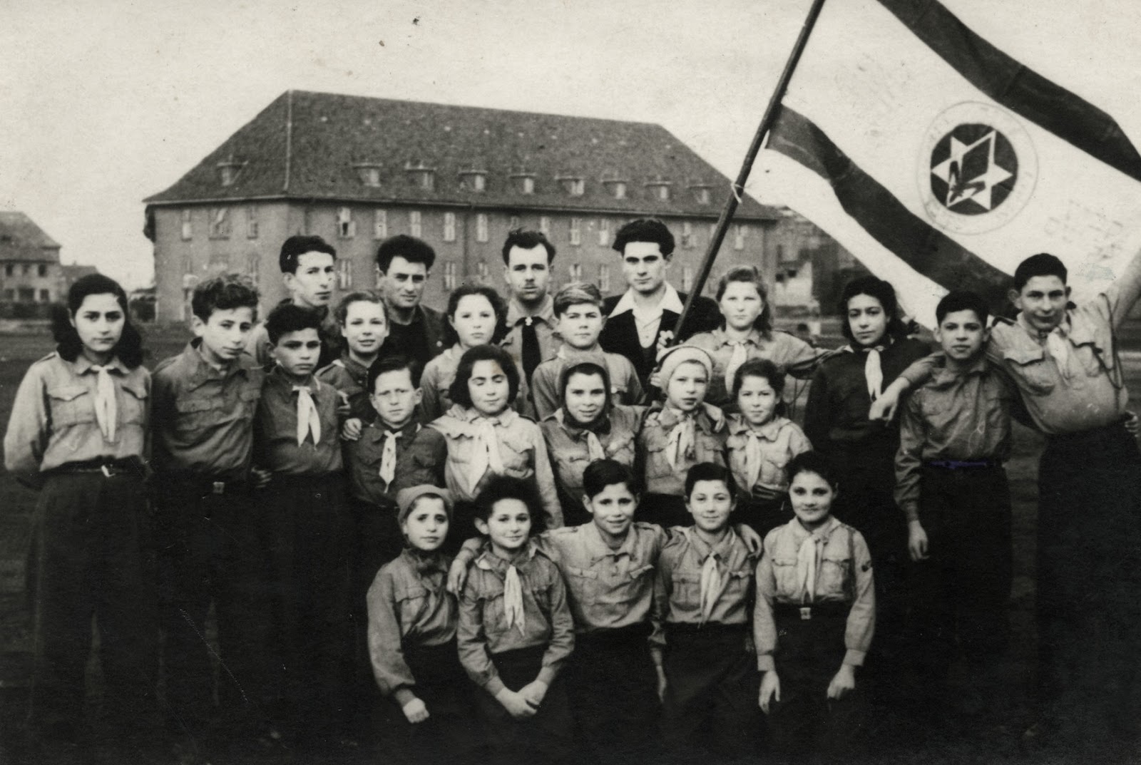 Group portrait of members of the Nitzanim group of the Zionist youth movement, Hanoar Hatzioni.

All of the children had been on the Exodus and had been sent back to Europe.  Ziomek Hammer (Shlomo HaMeiri) is pictured in the third row, fifth from the right.