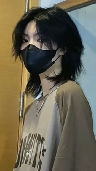 Girl on mask shows off her korean wolf cut