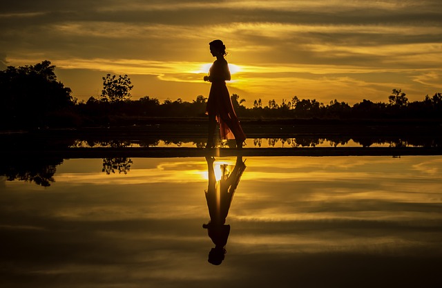 things to do while camping at night - a lady taking night walk