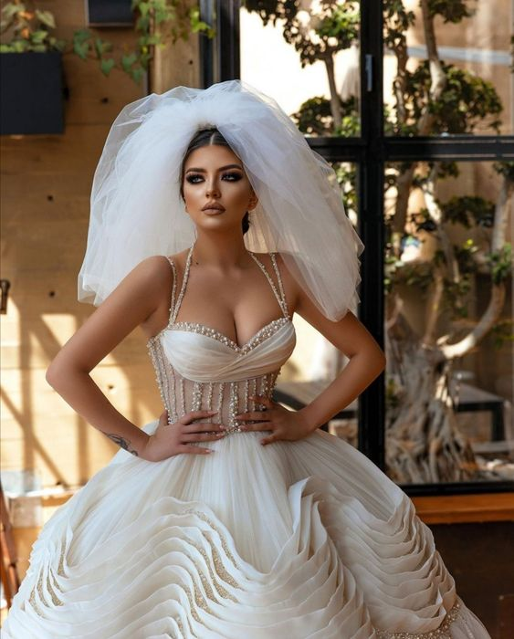 a lady wearing a gorgeous corset wedding dress