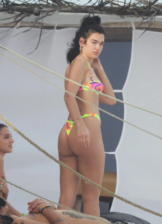 Dua LIpa Bikini: Pictures of the star in a multi colored bikini