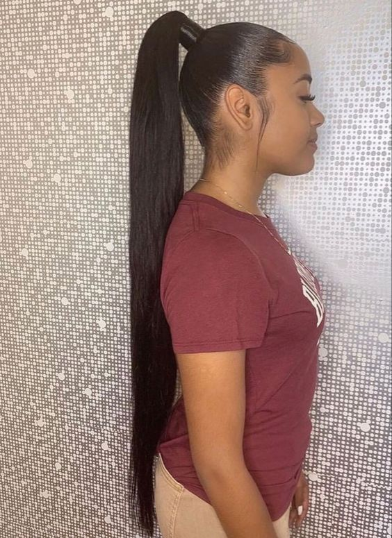 side view of lady wearing long high ponytail