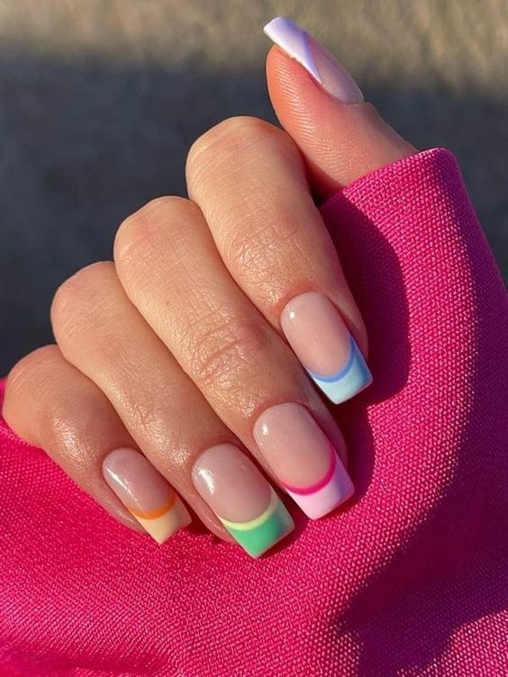 Lady shows off her colored french tips
