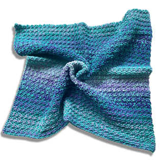 blue crochet baby blanket on white background