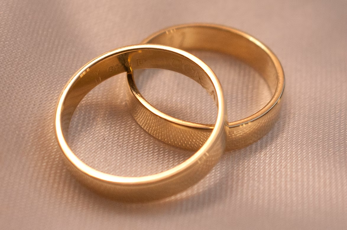 Two golden rings on a piece of fabric