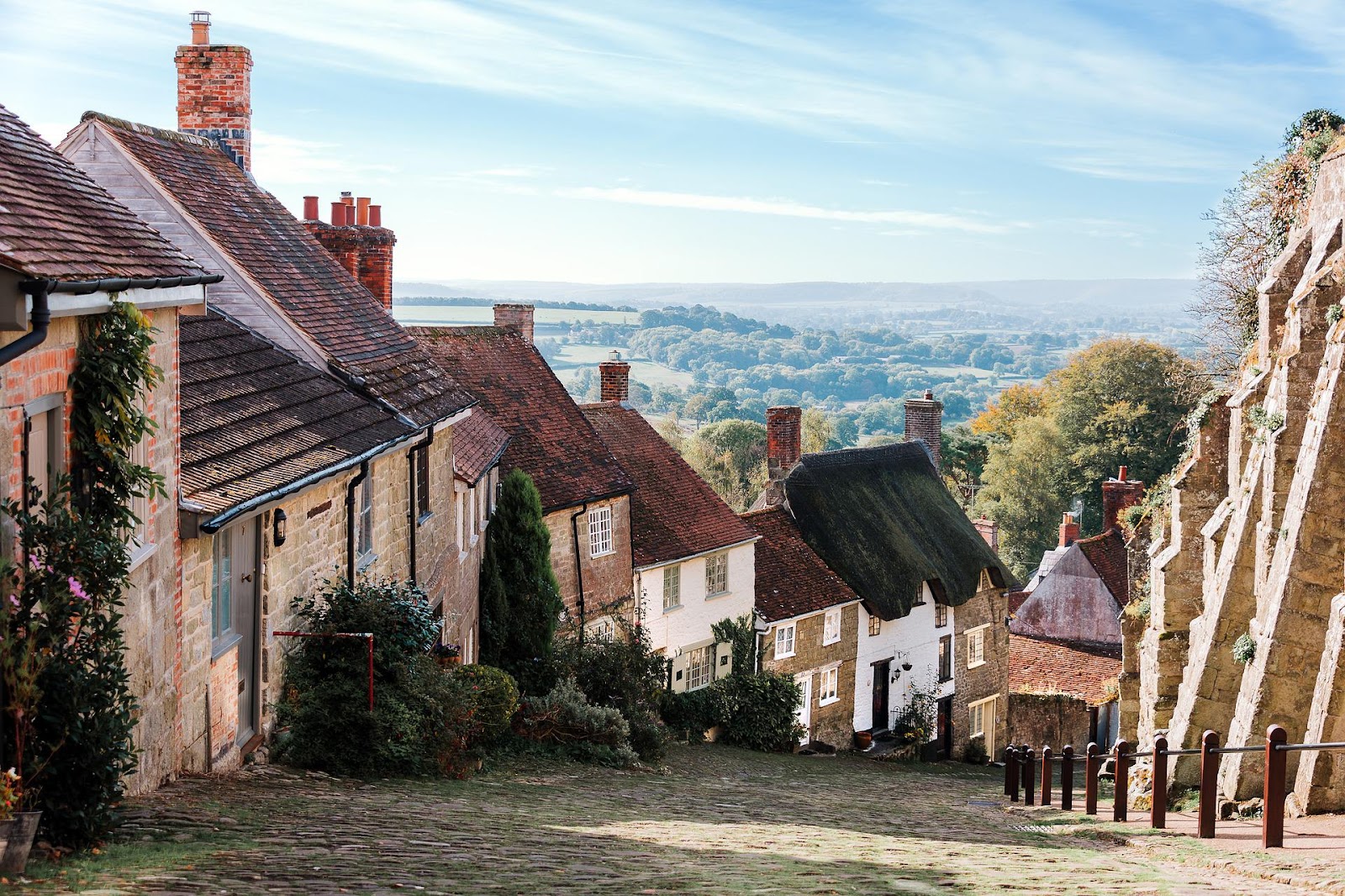 Cobbled village road in England with houses