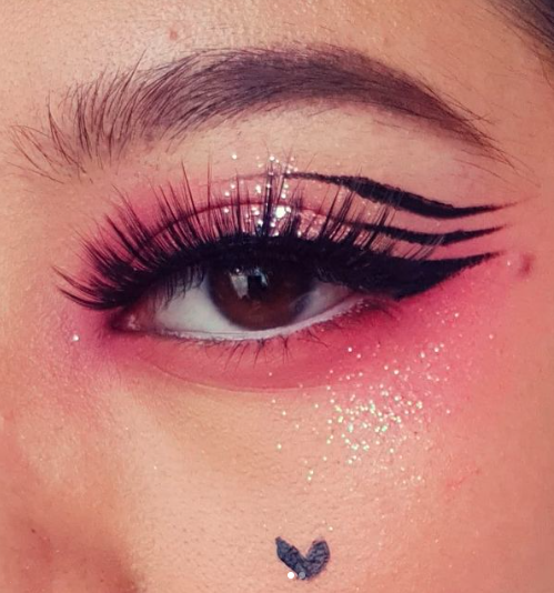 pink eye makeup look with triple winged eyeliner