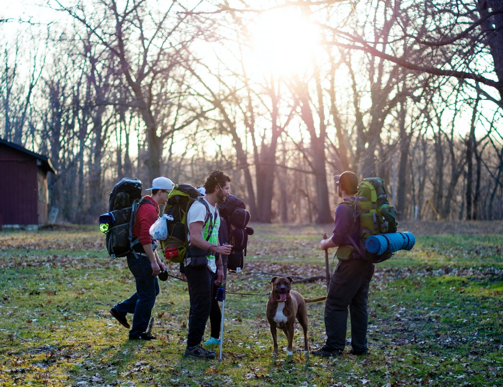 Friends and dog prepping for a hike