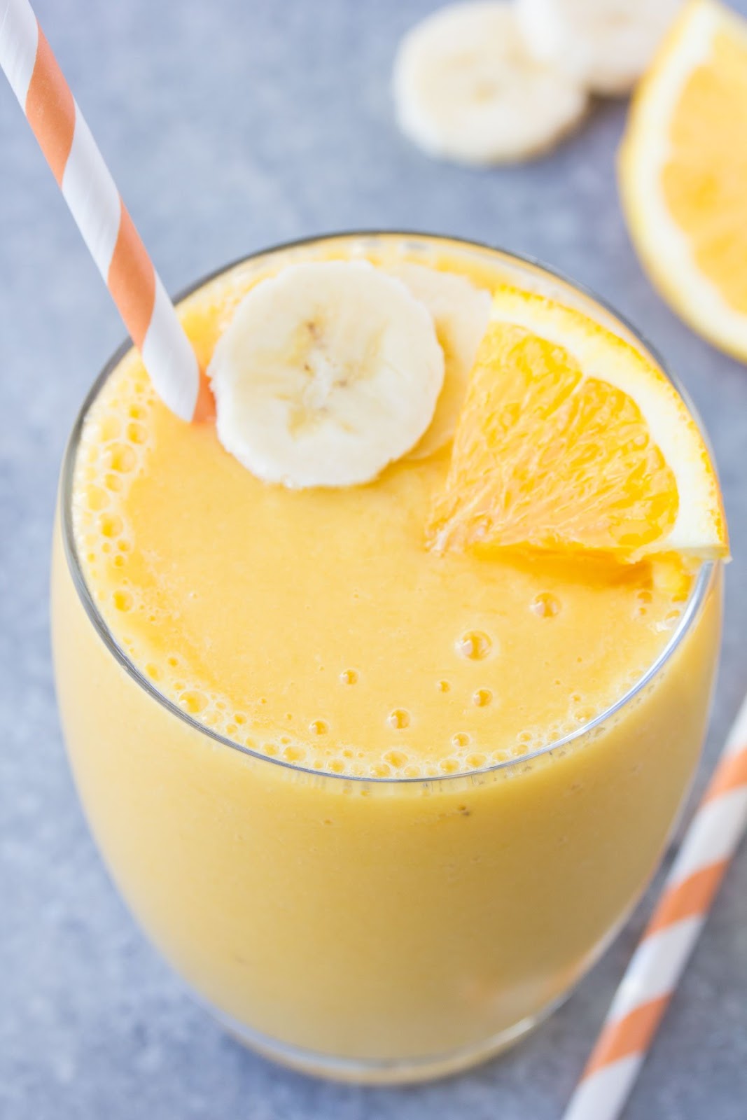 Immunity Boosting Orange Smoothie! This healthy smoothie packs a hefty dose of vitamin C! With orange, mango, banana and vanilla. | www.kristineskitchenblog.com