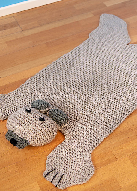 knit rug that looks like bear on floor