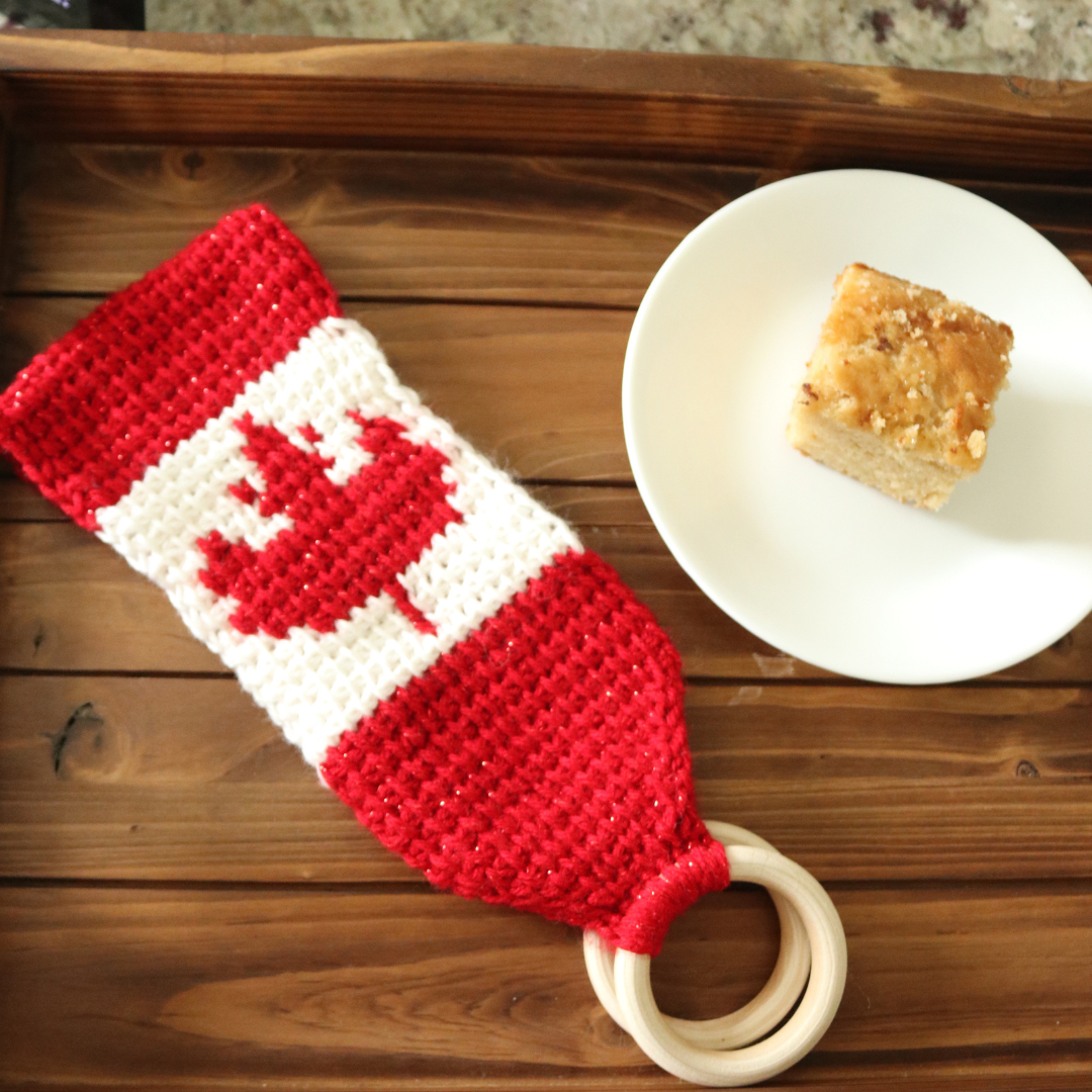 A Tunisian crochet towel topper pattern with a simple Canadian maple leaf colorwork section to practice basic Tunisian crochet stitches! 