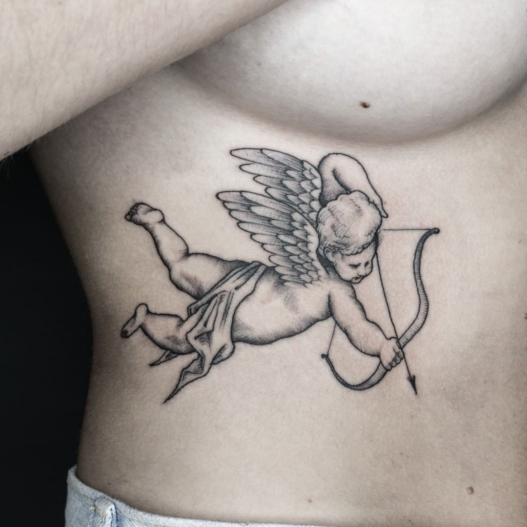 angel with bow tattoo