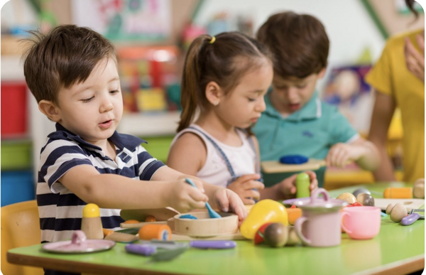 Preschoolers engaged in literacy activities