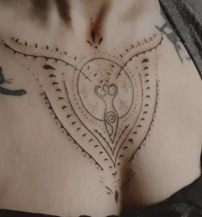 Great Goddess Tattooed On A Heart Chakra Chest Tattoo