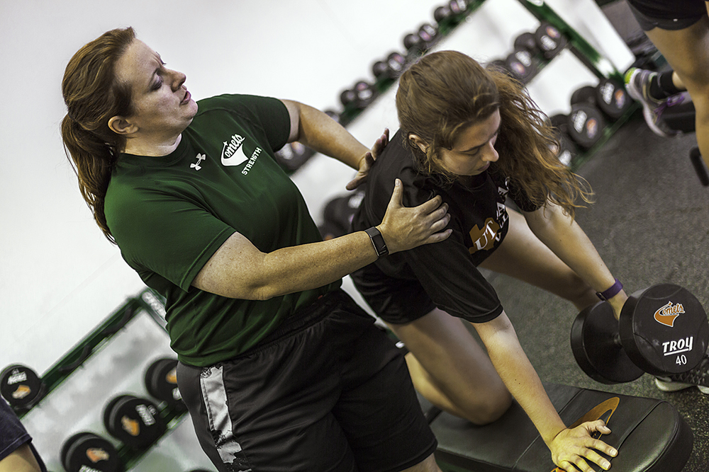 Coach Jami Clinton with a student in training