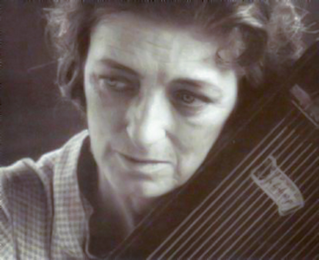 One of many exceptional country guitarists, Maybelle Carter playing the autoharp.