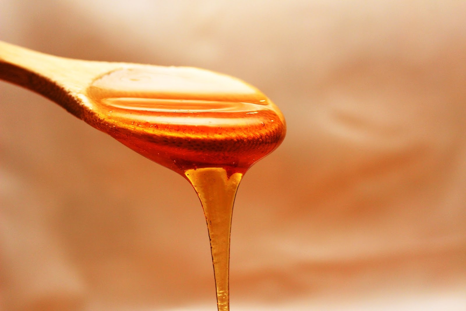 Compare date sugar to honey or maple syrup. Honey dripping from a spoon. 