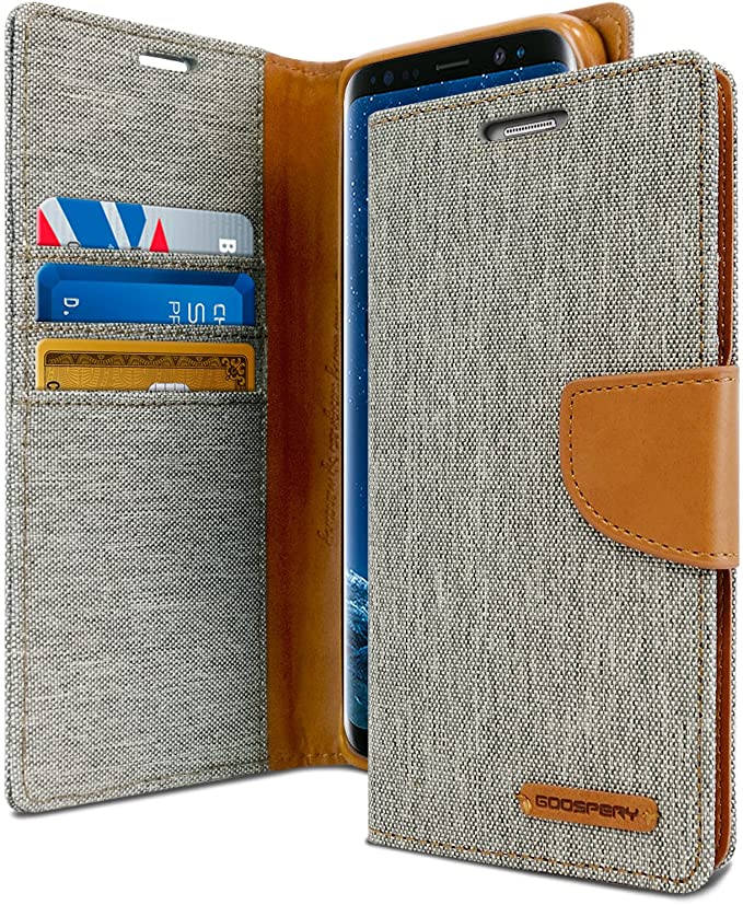 Gray Goospery canvas wallet with a sandy brown clasp 
