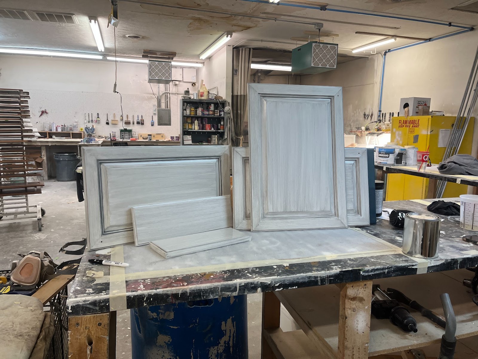 Glazed cabinet drawers and doors displayed.