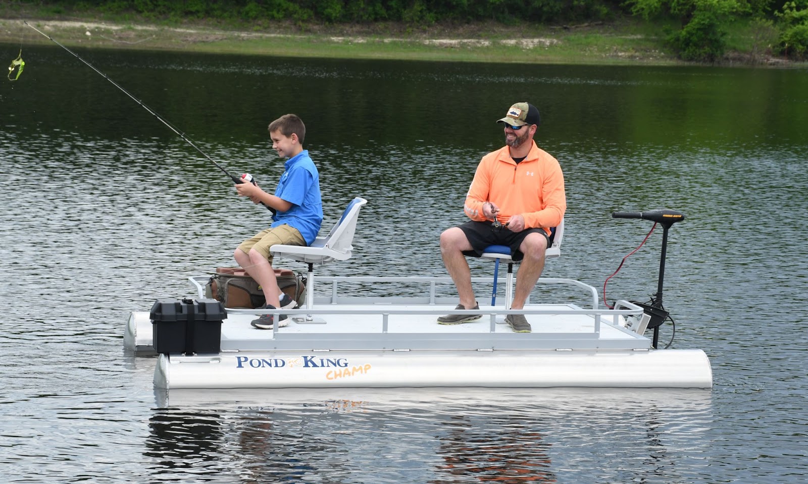 Father and son fishing on pontoon boat