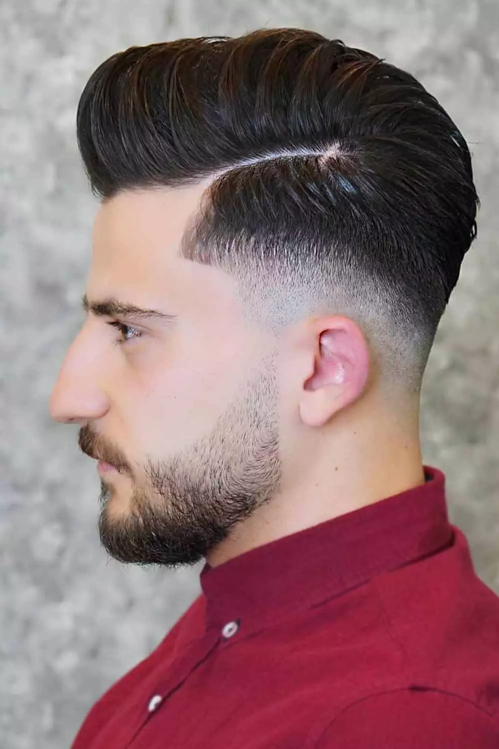 Side view of a guy rocking the side taper hairdo
