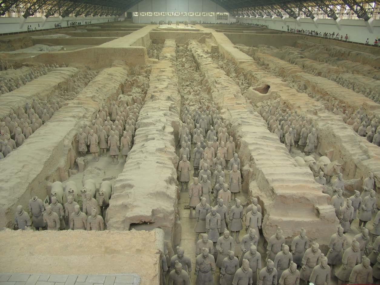 Excavated underground pit of the First Emperor of Qin, showing assembled terracotta infantry and horses pulling chariots.