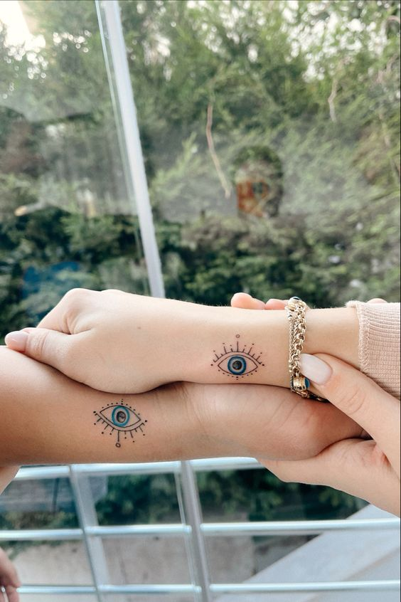 A picture showing off the beautiful tat design on two hands 