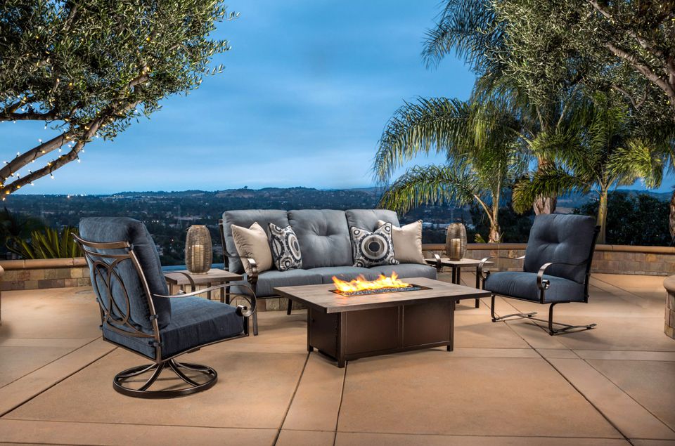 Open lounge with a fire pit table 