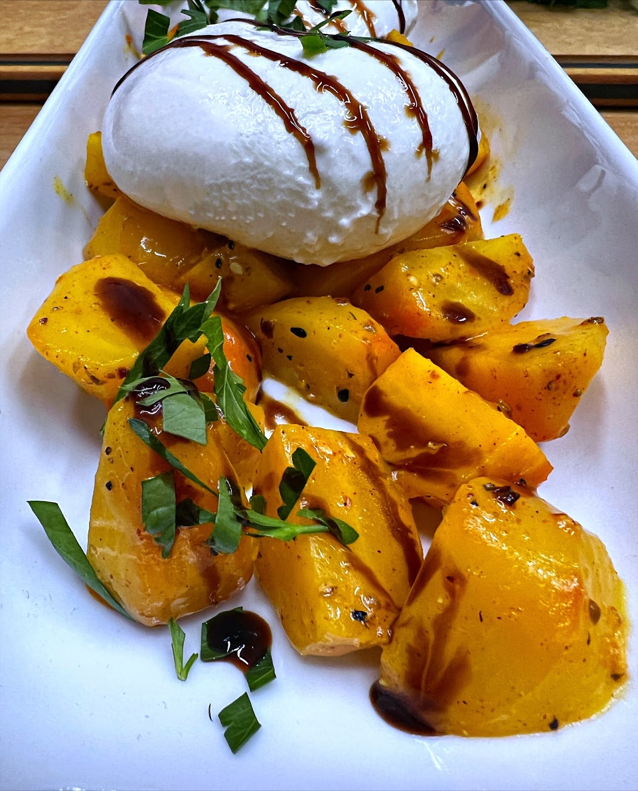 Chopped Golden beets provide a bed for creamy burrata cheese