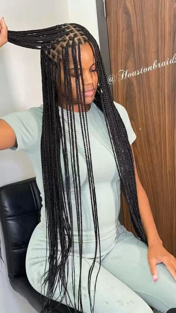 Full view of lady rocking this gorgeous small knotless braids