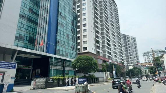 Làm “ấm” thị trường bất động sản - Ảnh 1.