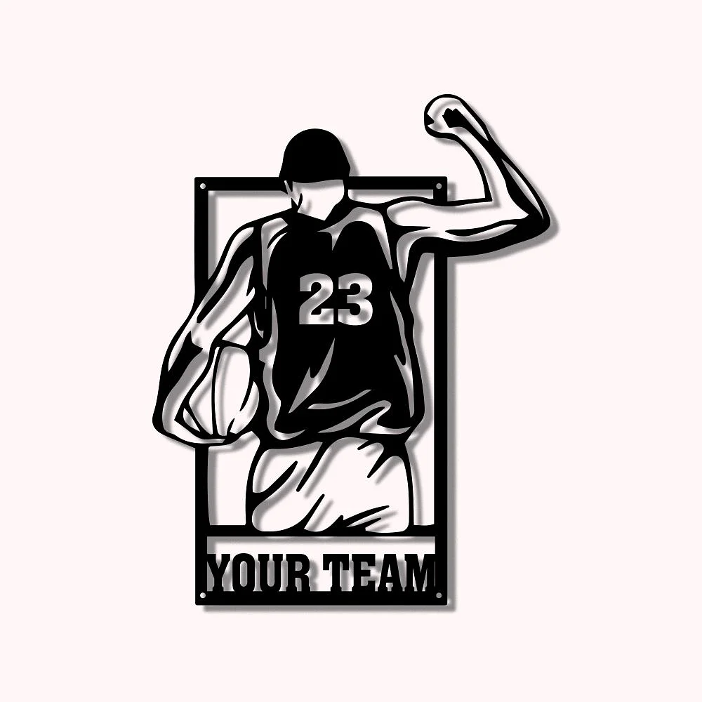 Décoration murale noire représentant un basketteur de dos portant le numéro 23, une balle dans une main et levant le point de l’autre. Un nom est présent au bas du joueur.