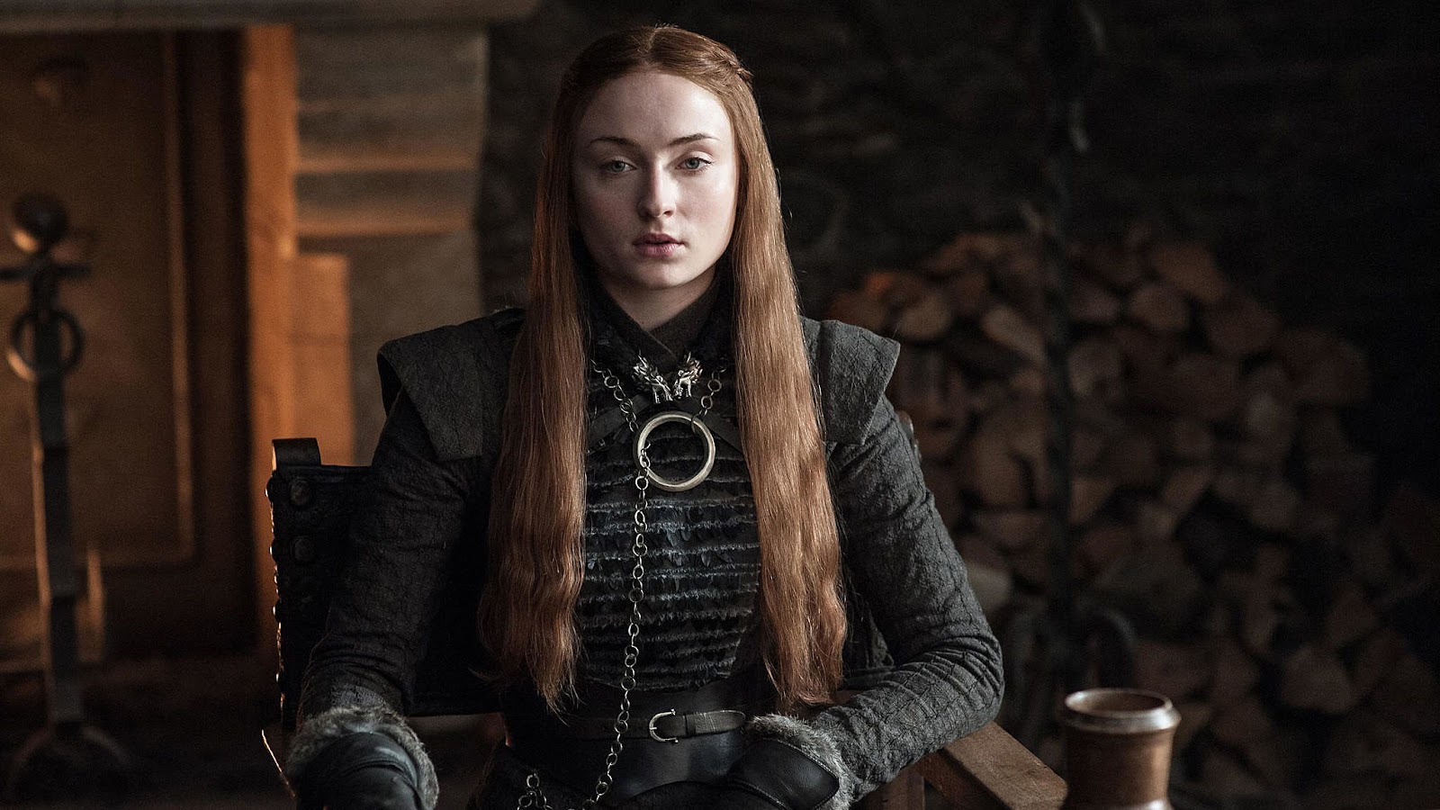 Sansa Stark (Sophie Turner) sits on a chair in scene from “Game of Thrones.”