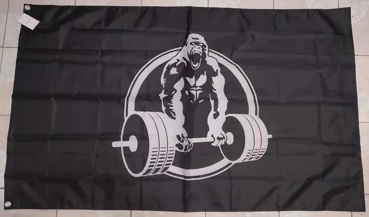 Personalized Gorilla Lifting Logo Garden Flag has the graphic of a gorilla that is lifting weights but offers an option to personlize