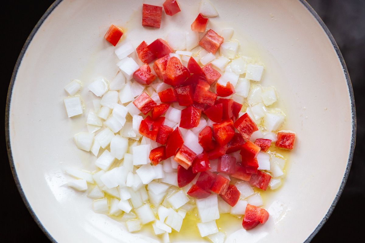 sautéed onions and bell pepper on nonstick pan  