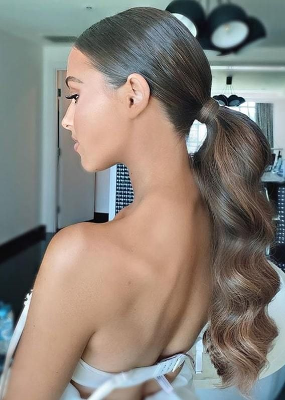 Woman wearing long brown ponytail hairstyle