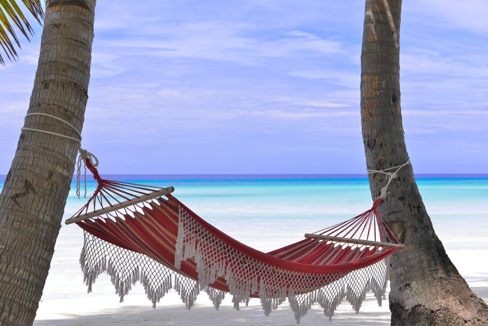 A hammock in Barbados makes for a nice break on your family holiday!