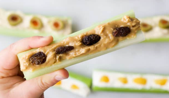 A hand holding a piece of food

Description automatically generated