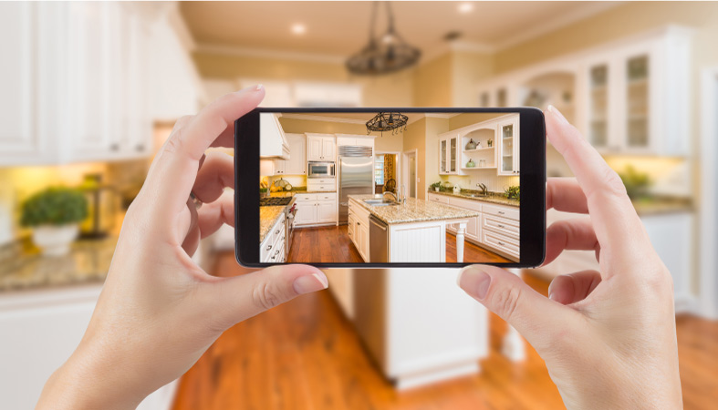 A person using an app to design their new kitchen