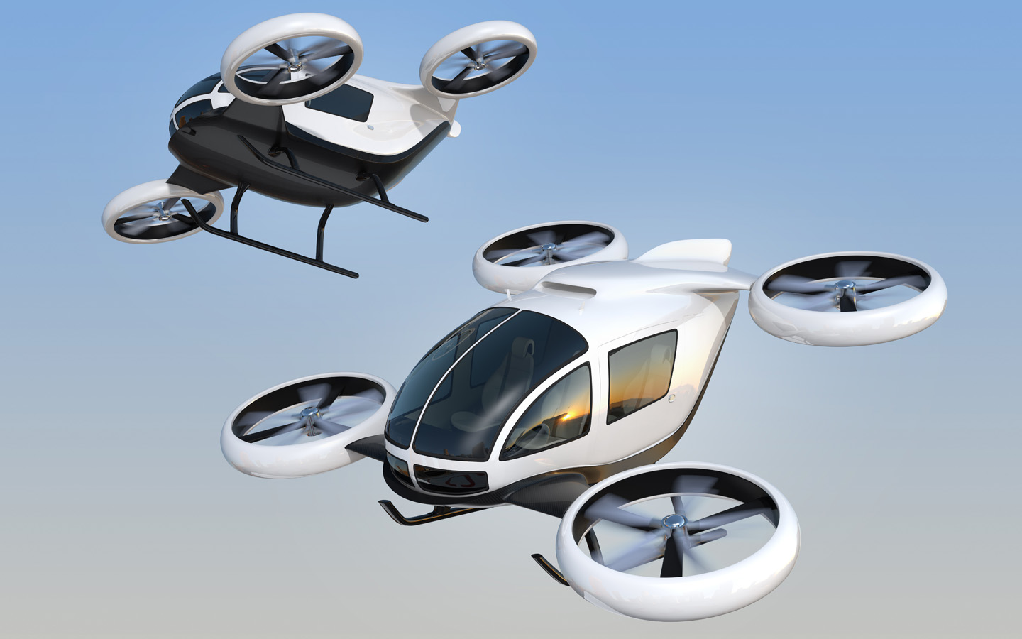 two passenger drones in air