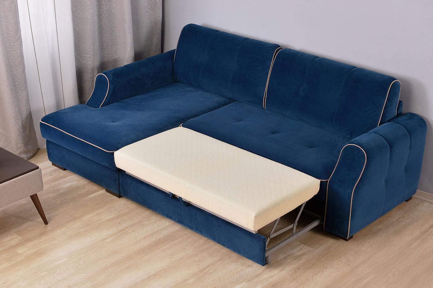 Разложенный синий диван