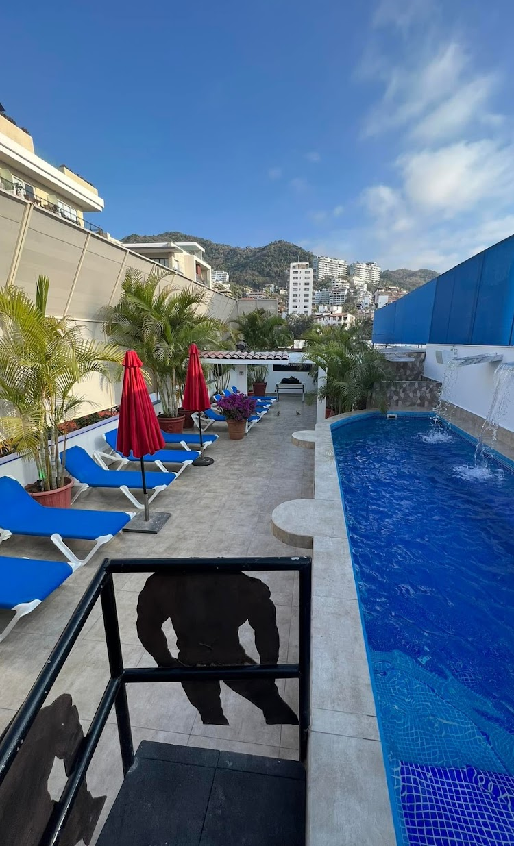 the exterior rooftop pool and lounge of club spartacus in PV, mexico