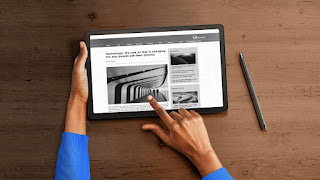 A person holding a tablet

Description automatically generated with low confidence