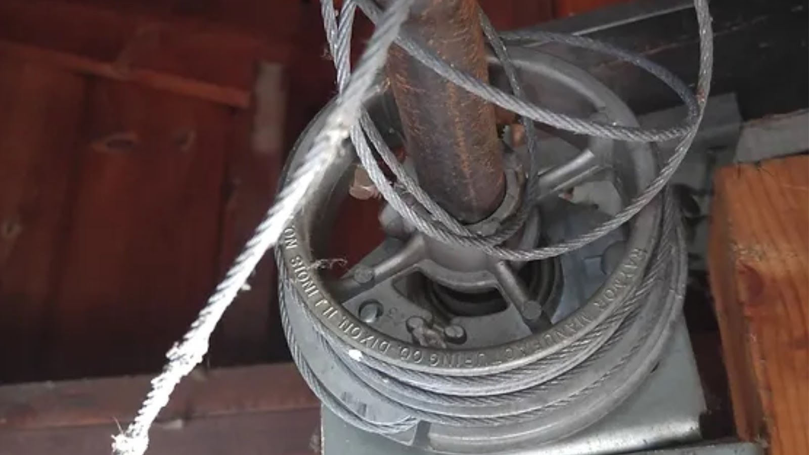 Garage door cables coming off the drum