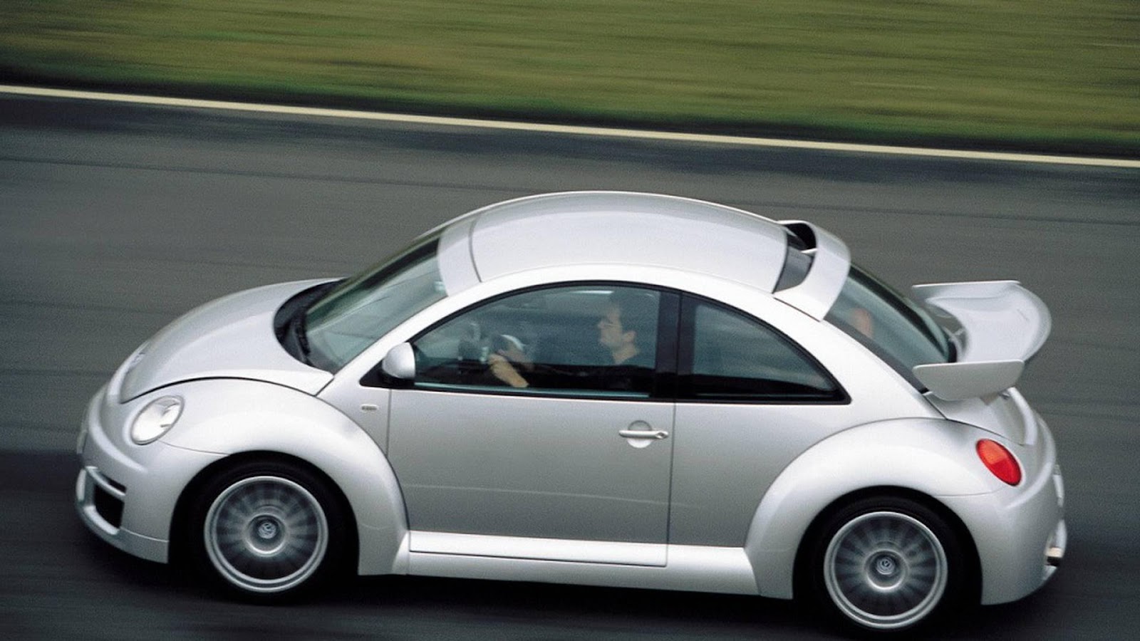 A white car on a road

Description automatically generated with medium confidence