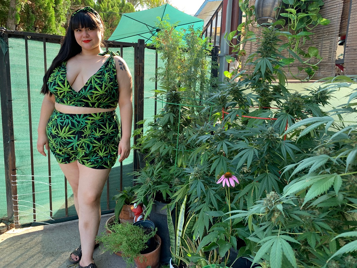 Chelly XiCali outside of her cannabis garden that she uses for her products. 